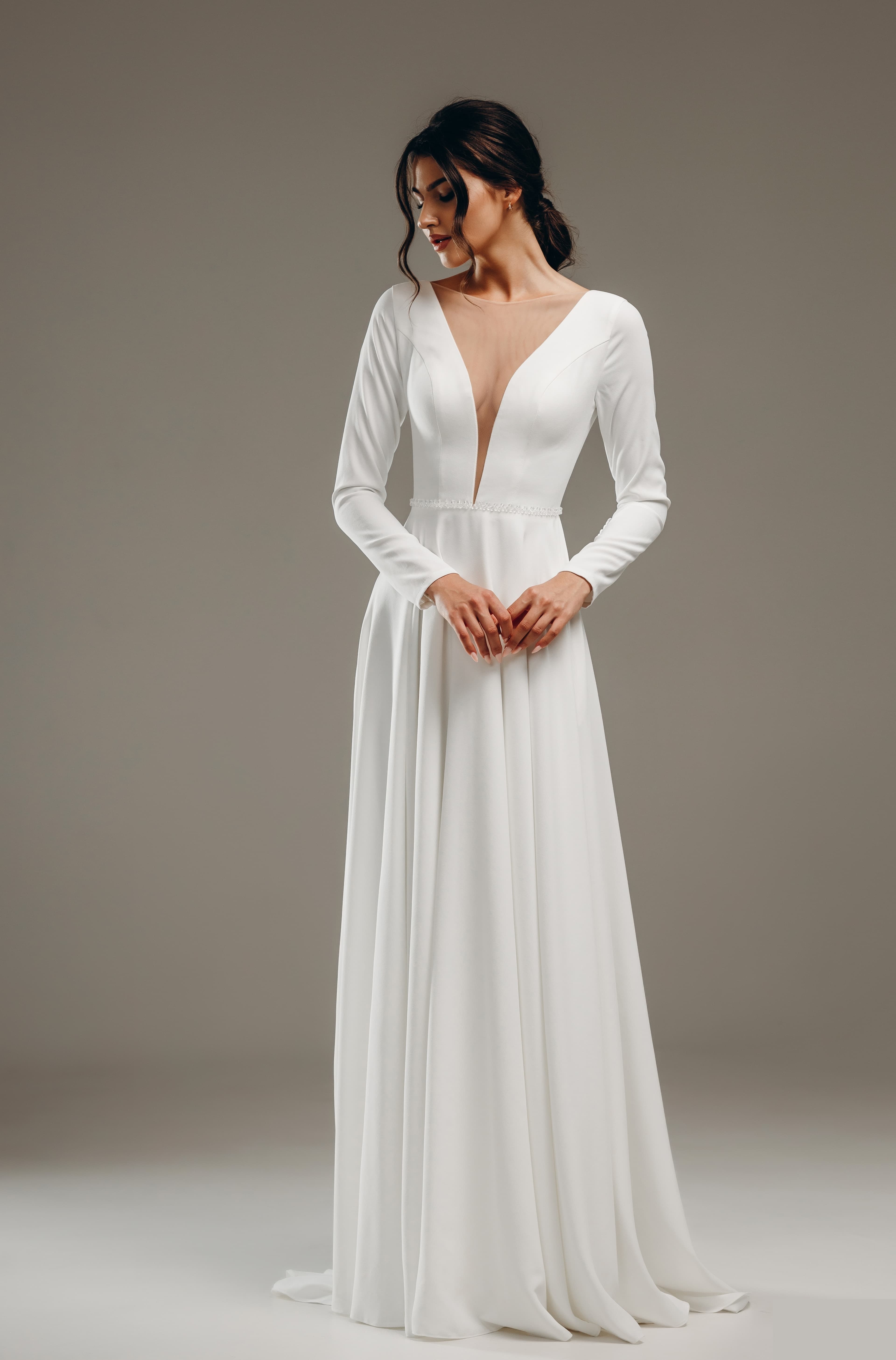 Minimal bridal silhouette with a clean strapless line.